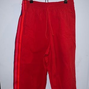 Adidas red track pants and Zara crop sweater